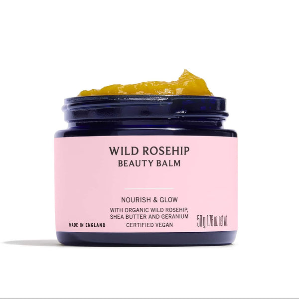 Jar of Wild Rosehip Beauty Balm with pink label on a white background