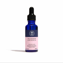 Blue bottle of Wild Rosehip Glow Facial Oil with a dropper on a white background