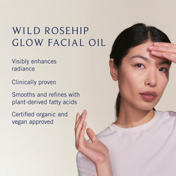 Woman applying facial oil with text about wild rosehip glow facial oil on a beige background