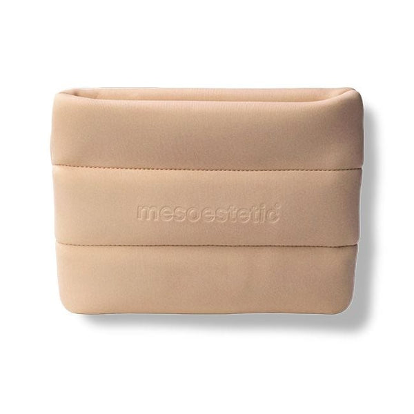 A beige fabric pouch with horizontal stitched bands and the brand name 'mesoestetic' embossed on the front, shown on a white background with a soft drop shadow.