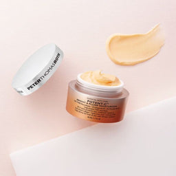 Peter Thomas Roth Potent-C Bright & Plump Moisturizer with its lid removed and a smudge of texture next to it
