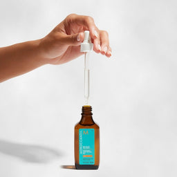 Moroccanoil Dry Scalp Treatment being poured