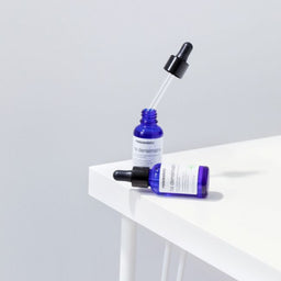 Two vials of mesoestetic HA Densimatrix on a white table
