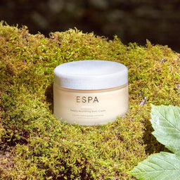 ESPA Deeply Nourishing Body Cream on a mound of moss
