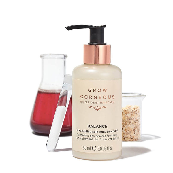 Grow Gorgeous Balance Fibre-Sealing Split Ends Treatment bottle in front of test tubes and a jar of oats