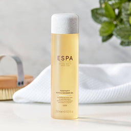 ESPA Positivity Bath & Shower Gel bottle on a bathroom countertop