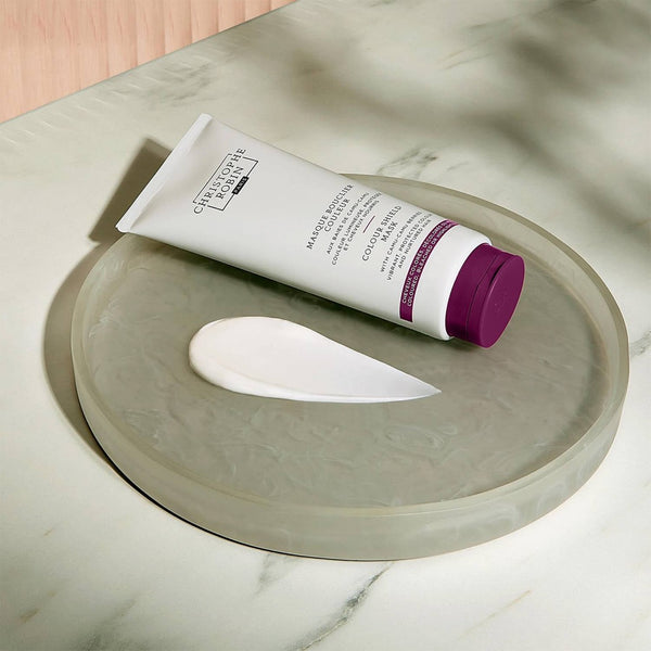 Christophe Robin Color Shield Mask With Camu-Camu Berries placed on a plate with the texture spread next to the tube