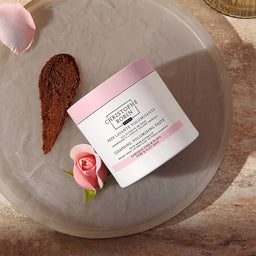 Christophe Robin Cleansing Volumizing Paste on a clear plate with the texture spread next to it