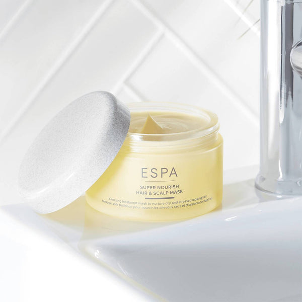 ESPA Active Nutrients Super Nourish Hair and Scalp Mask tub placed on the side of the sink