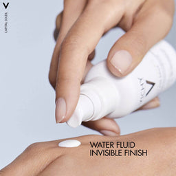 Vichy Capital Soleil Uv Age Daily Spf 50+ Invisible Sun Cream With Niacinamide 40ml applied to hand