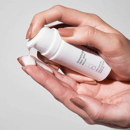 model applying Dermalogica PowerBright Dark Spot Serum