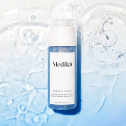 Medik8 Press & Clear on a pool of sparkling water