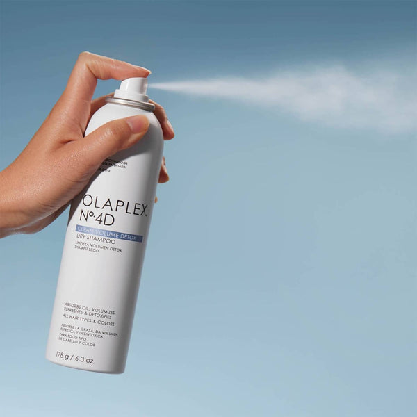 Olaplex No.4D Clean Volume Detox Dry Shampoo being sprayed into the air