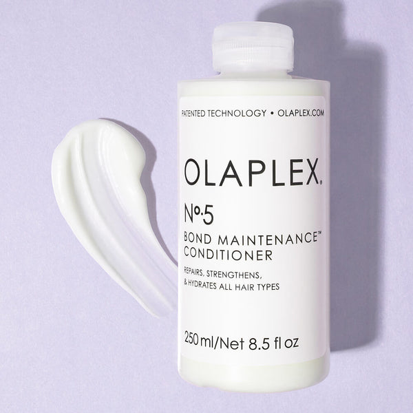 Olaplex No.5 Bond Maintenance Conditioner bottle on top of a smear of conditioner
