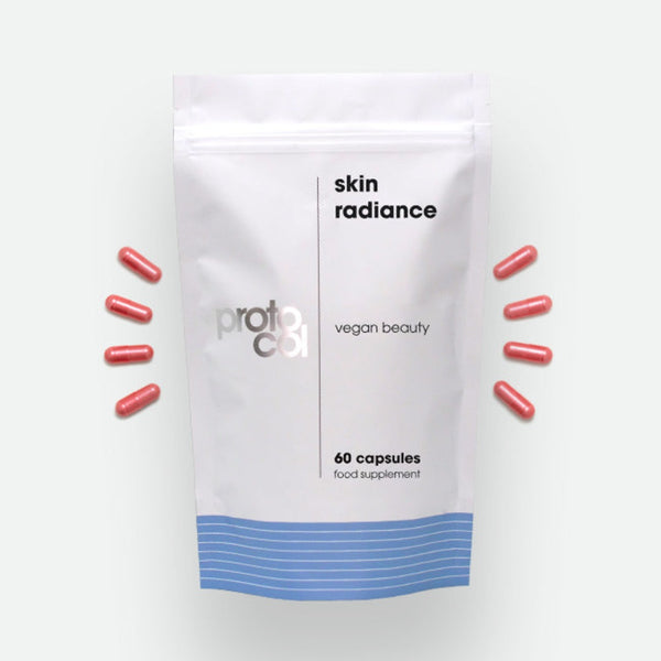 Proto-col Skin Radiance with four capsules on the left and right side of the packet