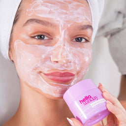 a women with Hello Sunday The Recovery One Glow Face Mask applied to her face