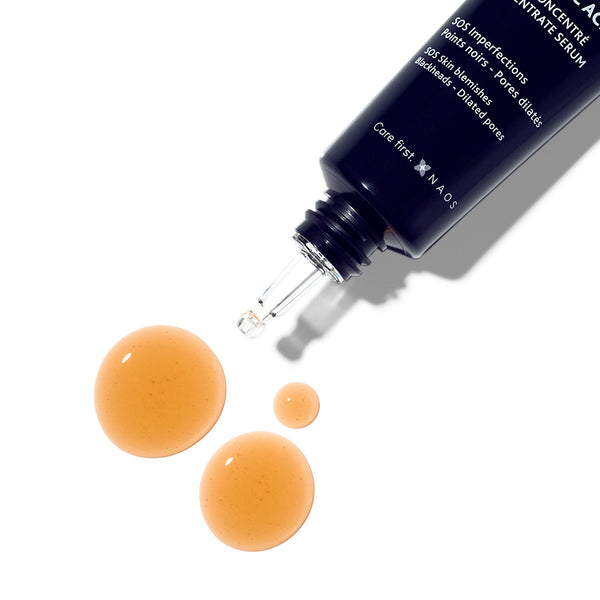 Institut Esthederm Intensive Propolis+ Concentrate Serum Tube with threee orange droplets placed next to the tube