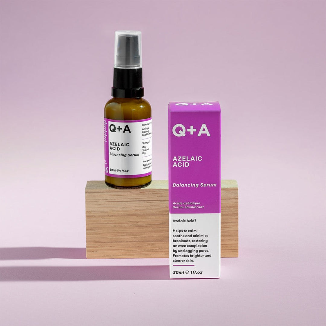 Q+A Azelaic Acid Facial Serum on a wooden block