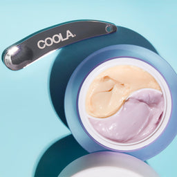COOLA Day SPF30+Night Eye Cream Duo with a metallic scoop