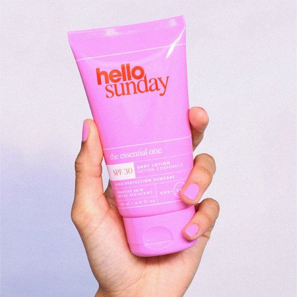 Hello Sunday The One For Your Body SPF 30 Body Lotion held in the air