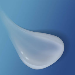 Cetaphil Gentle Skin Cleanser poured onto a blue background