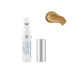 Colorescience Total Eye 3-in-1 Renewal Therapy SPF 35 with its contents poured out next to the bottle
