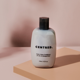 CENTRED. Daily Calma Conditioner bottle sat on a counter