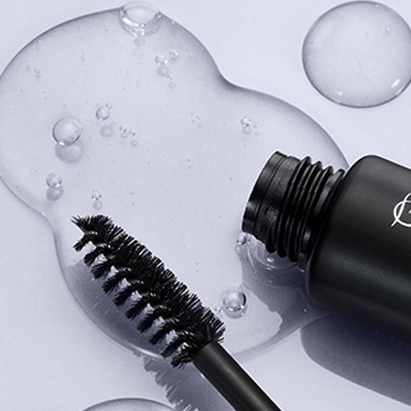 a HD Brows Brow Glue tub tipped over with its contents pouring out