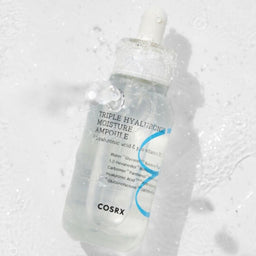 COSRX Hydrium Triple Hyaluronic Moisture Ampoule dropped into water