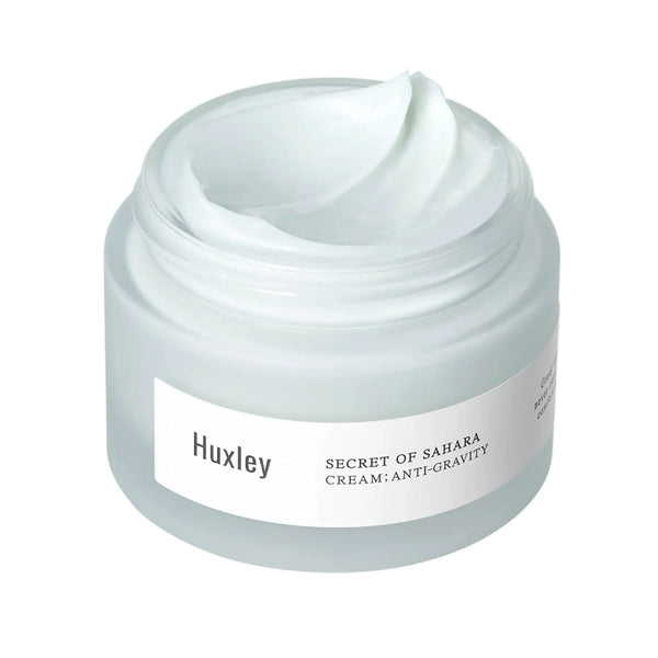 Huxley Cream; Anti-gravity with an open lid showing its contents