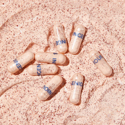 a range of capsules on a sandy surface