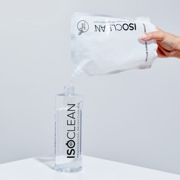 ISOCLEAN Makeup Brush Cleaner - Eco Refill being poured into a bottle