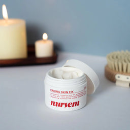 Nursem Caring Skin Fix 50ml with its lid removed on a bedside cabinet