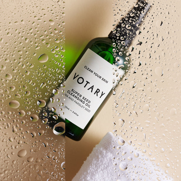 VOTARY Super Seed Cleansing Oil - Chia and Parsley Seed behind water splashes