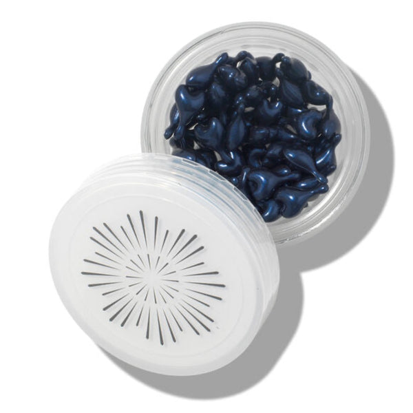 OSKIA Super R Retinoid Sleep Serum Capsules with an open lid showing the capsules inside