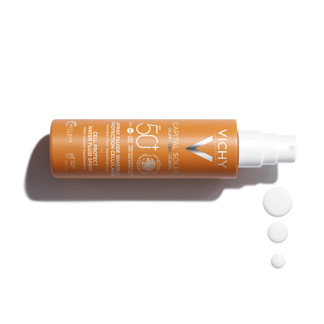 Vichy Capital Soleil Cell Protect Invisible High UVA + UVB Sun Protection Spray SPF50+ for All Skin Types 200ml next to drops