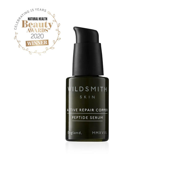 Dark green Wildsmith Skin Active Repair Copper Peptide Serum 30ml bottle next to Natural Health Beauty Awards 2020 Winner logo