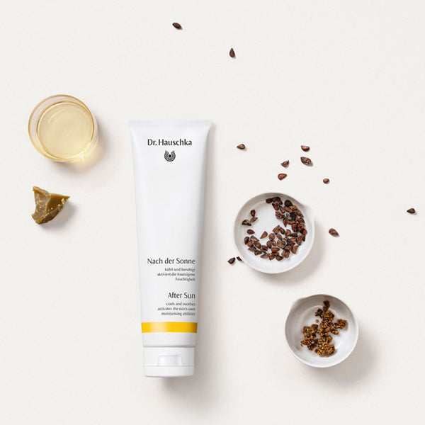 Dr Hauschka After Sun tube next to a range on ingredients