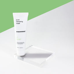 mesoestetic Pure Renewing Mask on glass slate with green background