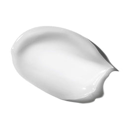The cream contents of mesoestetic Bodyshock Celluxpert smeared onto a white background