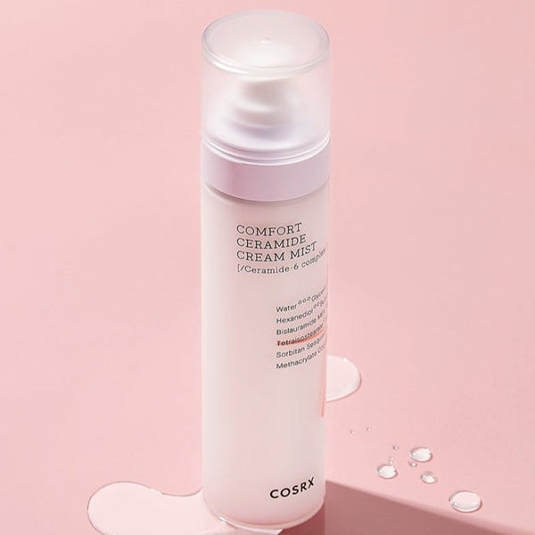 COSRX Balancium Comfort Ceramide Cream Mist bottle on a pink background