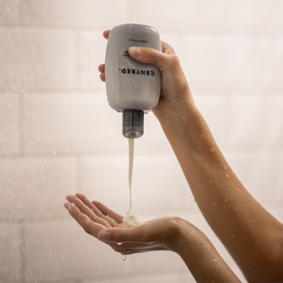 CENTRED. Daily Calma Conditioner bottle being poured into a hand