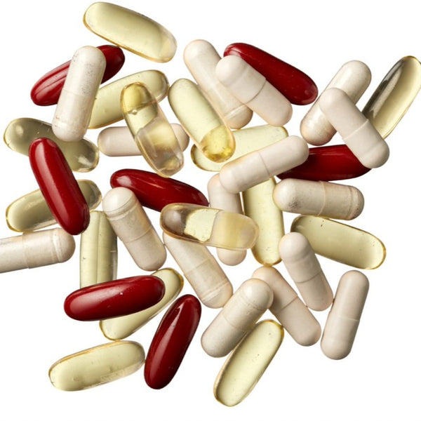 A range of red, white and yellow daily capsules 