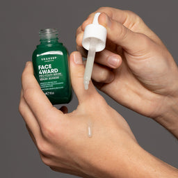 a pipette applying the serum to a hand