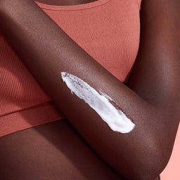 a closeup of an arm with the lotion applied