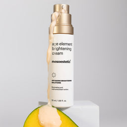 A container of mesoestetic Age Element Brightening Cream with its contents trickling down the side of the bottle