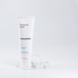 mesoestetic Hydravital Mask next to three glass orbs