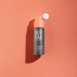 Nip+Fab Charcoal Fix & Mandelic Acid Serum bottle with the serum pouring from the top
