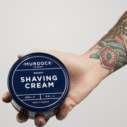 Murdock London Shaving Cream held out by a tattooed arm