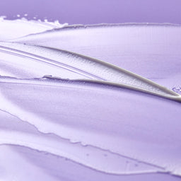 Retinol eye cream texture shot close up swatch on purple background